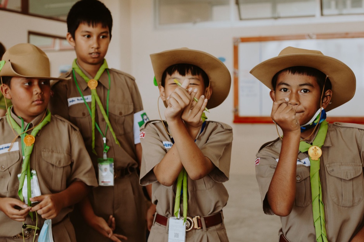 Thai children playing with learning gadgets