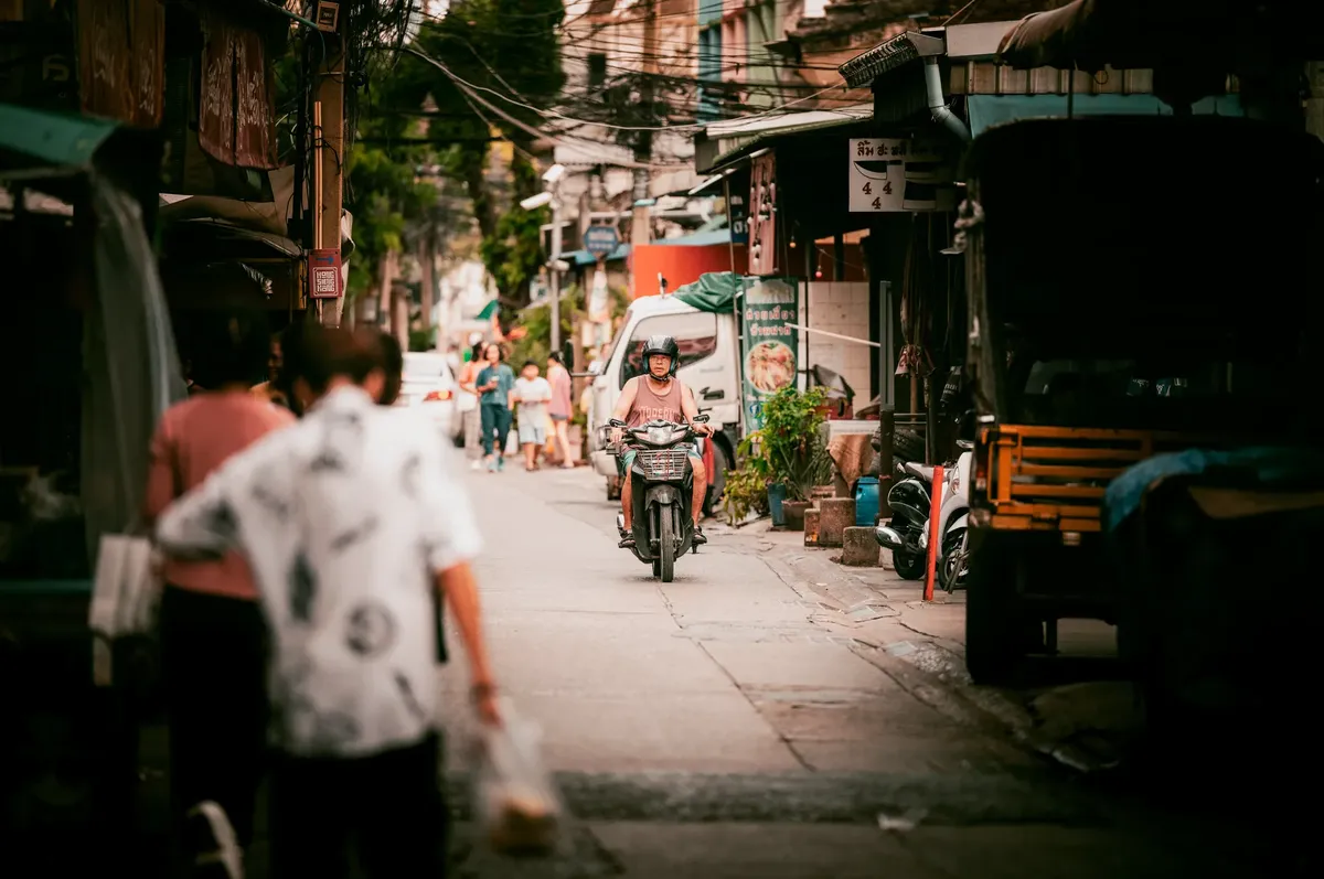 A vibrant street scene in Bangkok highlighting everyday life and local culture.