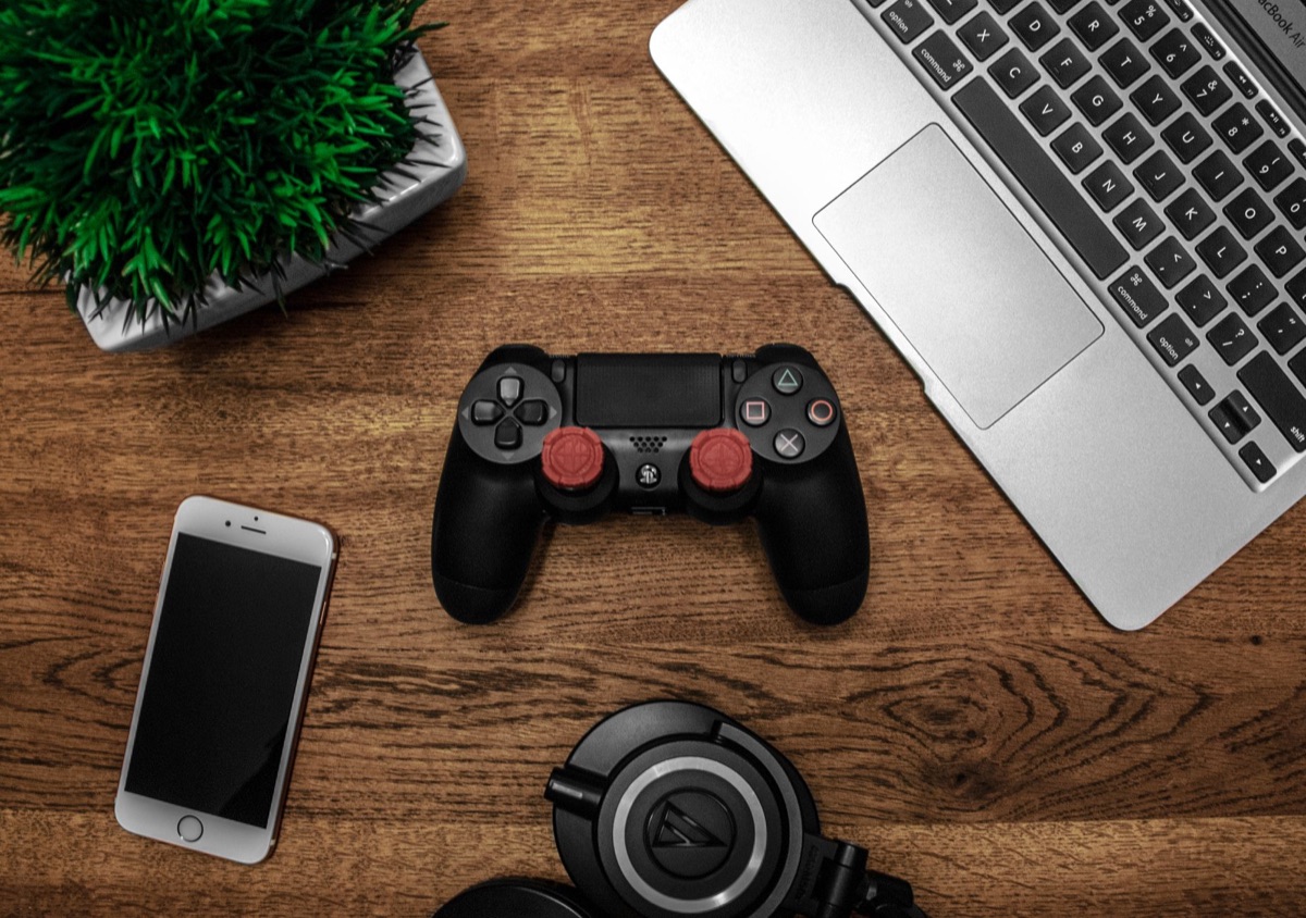 Close up of a hand holding a smartphone playing a mobile game