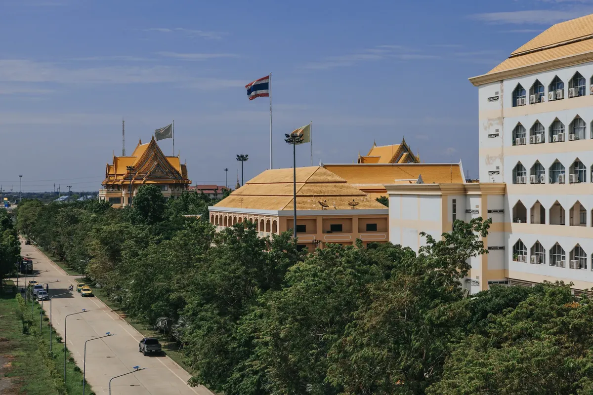 A scenic view of Ayutthaya university campus with golden roofs in Thailand, showcasing traditional architecture.